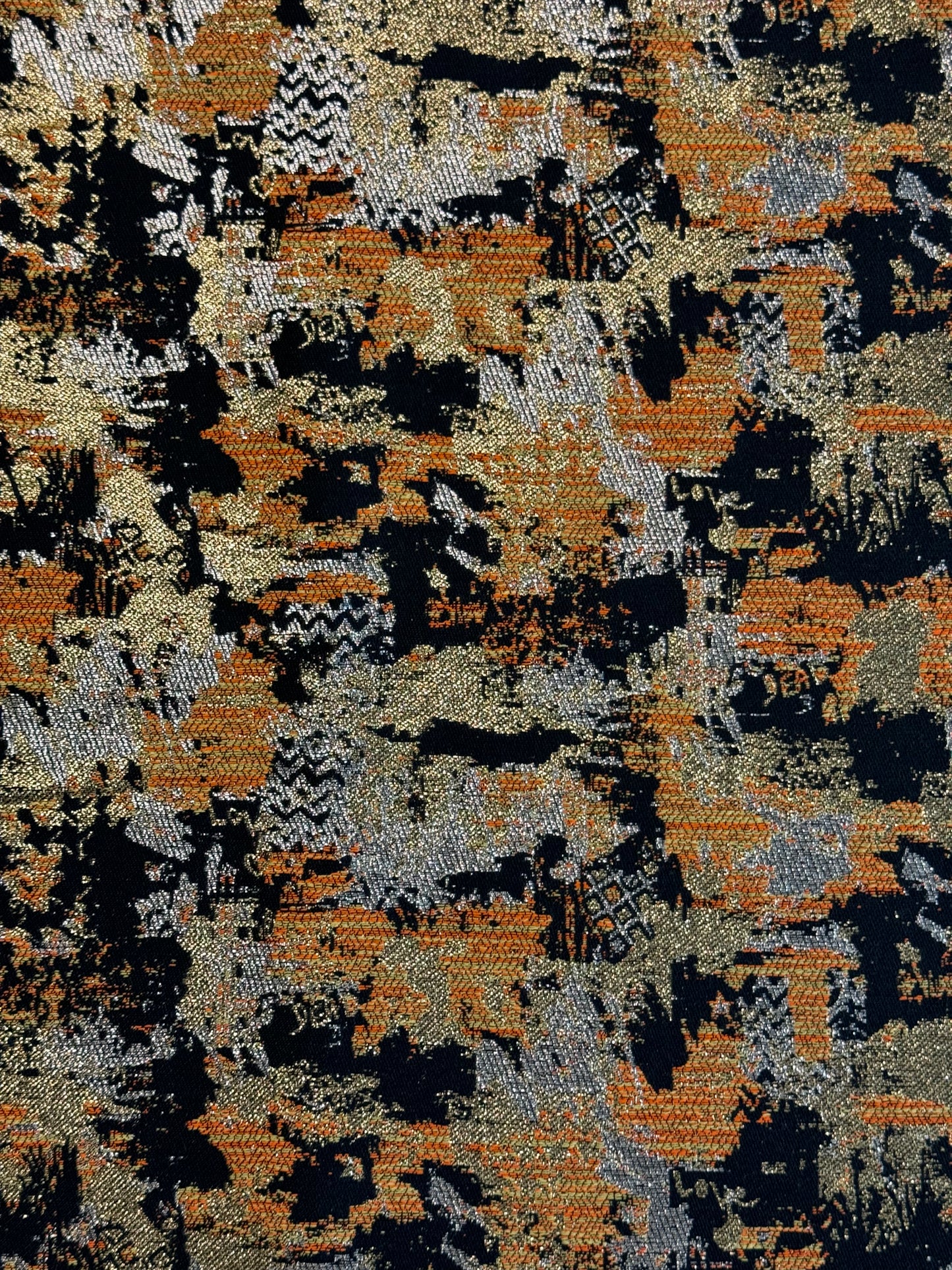Tissu effet peinture noir orange doré - L: 1,60 m