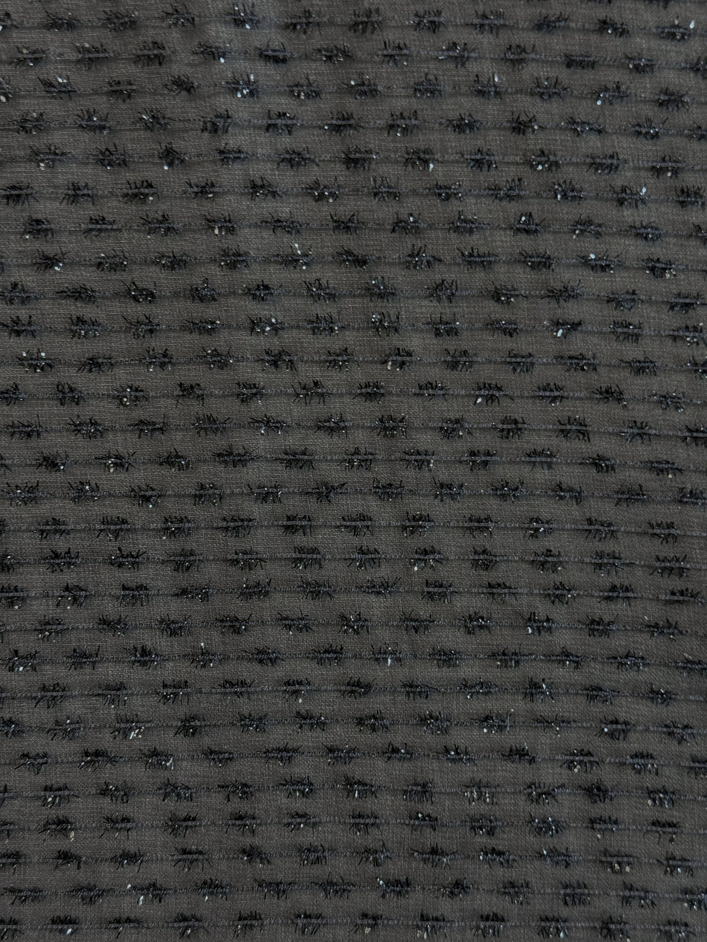 Tissu au mètre, Organza tissé avec des fils texturés noir