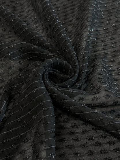 Tissu au mètre, Organza tissé avec des fils texturés noir