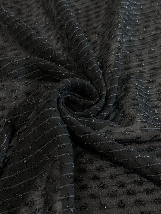 Tissu au mètre, Organza tissé avec des fils texturés noir