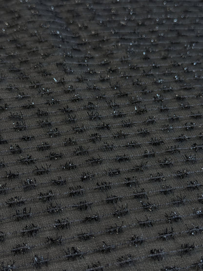 Tissu au mètre, Organza tissé avec des fils texturés noir